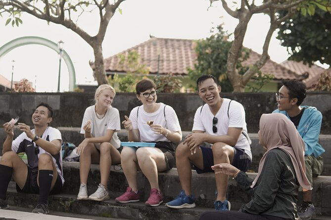 Jogja Hidden Gems - Cycling Tour - Tamansari market snacks and the Masangin banyan-tree pause
